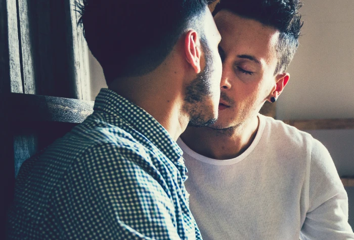 Gay couple kissing